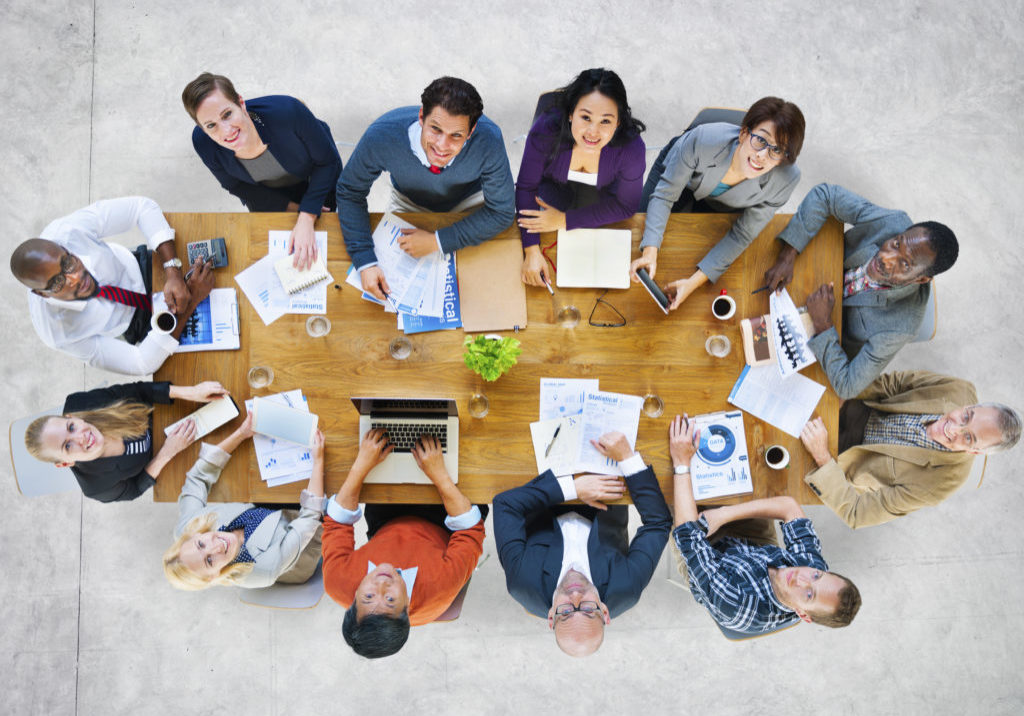 Multi-Ethnic Group of People in a Meeting Looking Up